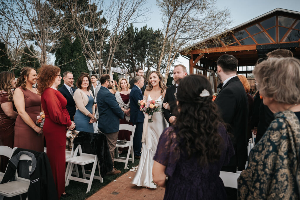 bride processional at wedding ceremony at sky ranch lodge