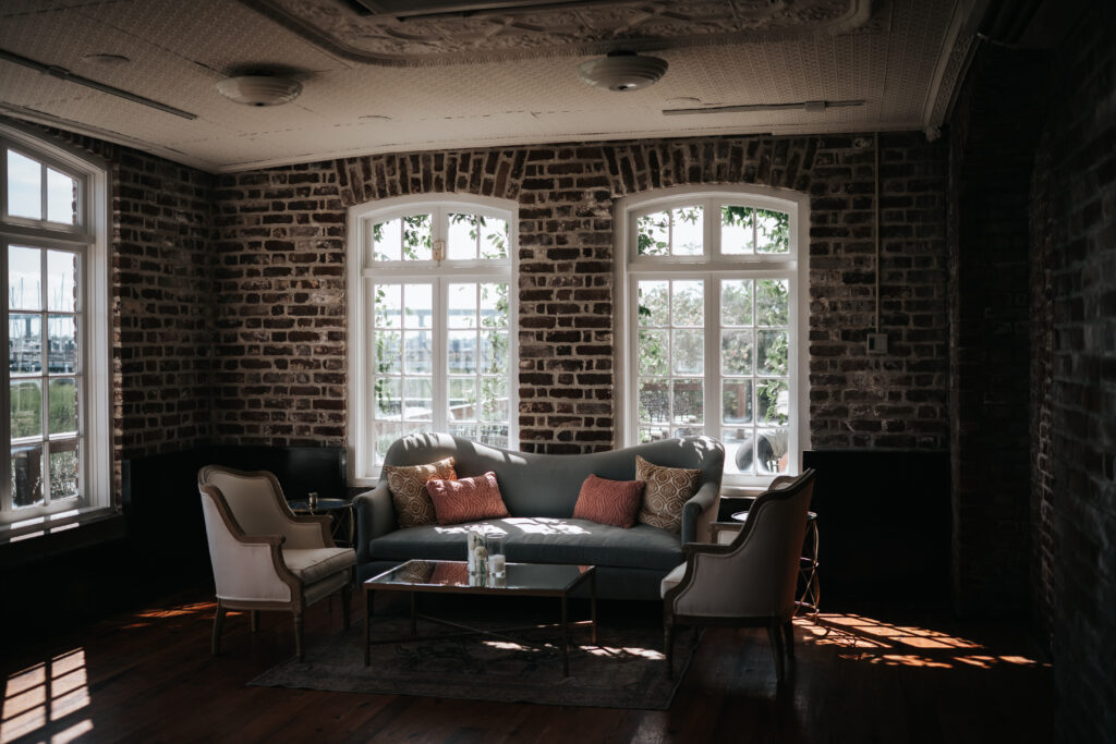 lounge area by the french eclectic as a rice mill wedding in charleston sc