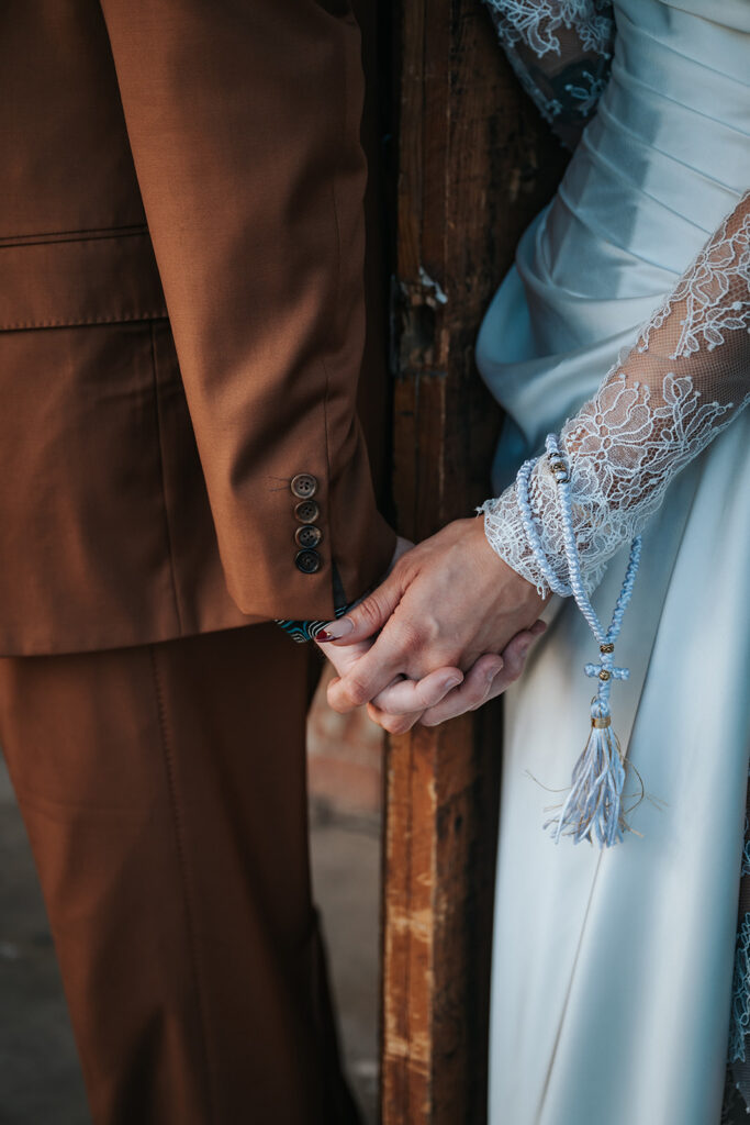 Emotional first touch before a downtown Phoenix wedding ceremony