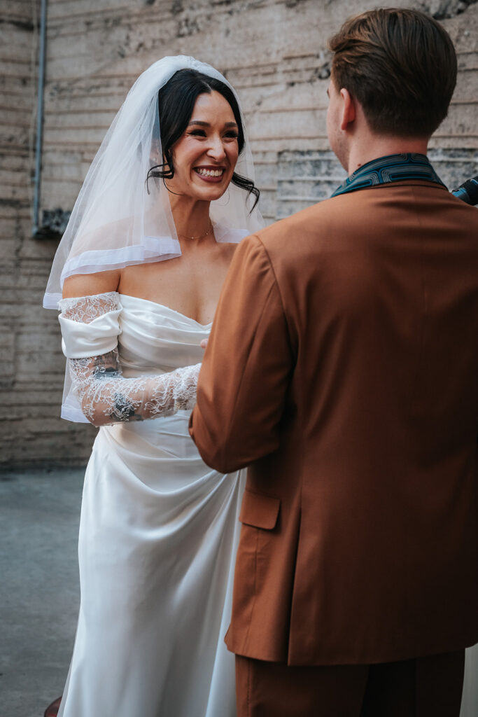 Bride and groom exchanging vows during an Icehouse Phoenix wedding