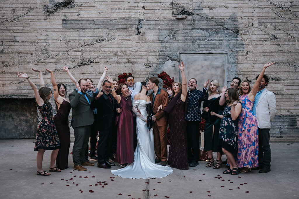 Rachel and Devin taking family portraits after their ceremony at The Icehouse