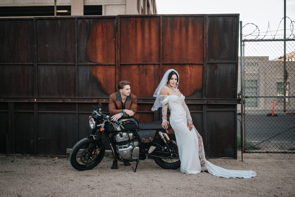 Rachel smoking beside Devin’s motorcycle after the ceremony