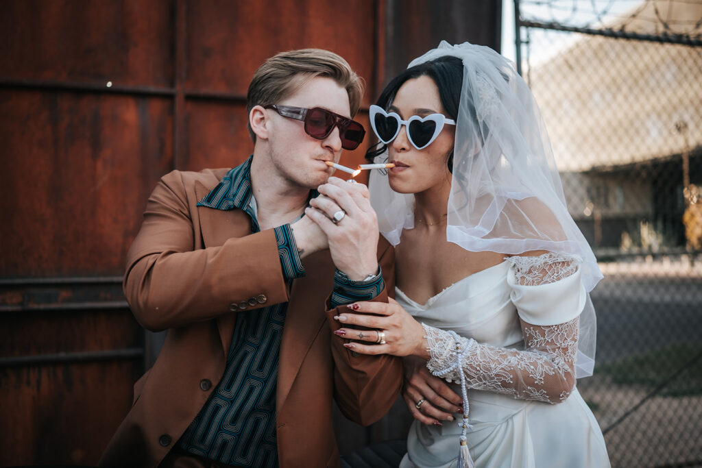 Rachel smoking beside Devin’s motorcycle after the ceremony
