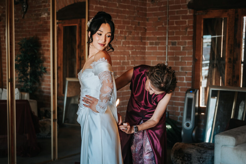 Rachel getting ready in the moody bridal suite at The Icehouse in Phoenix